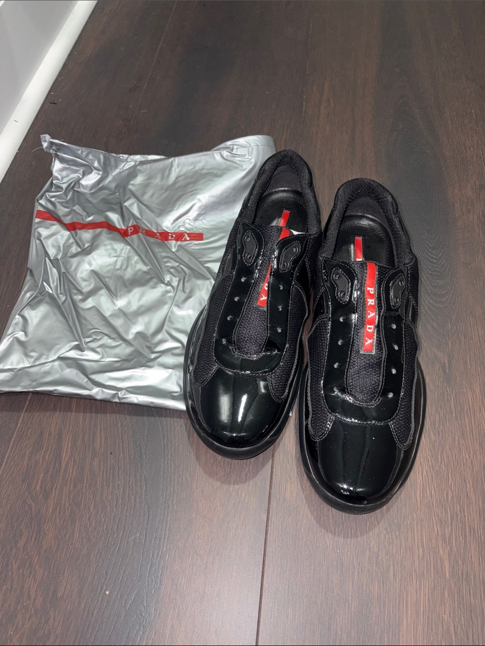 Prada Black Leather & Mesh Sneakers with Red Logo Tape
